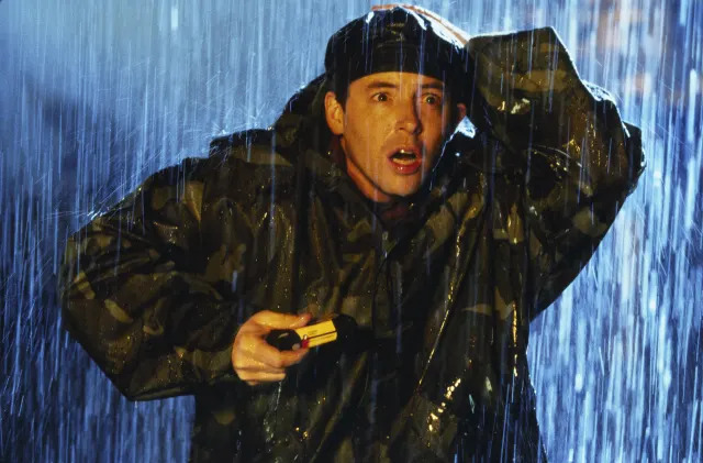 A man looks terrified in the rain
