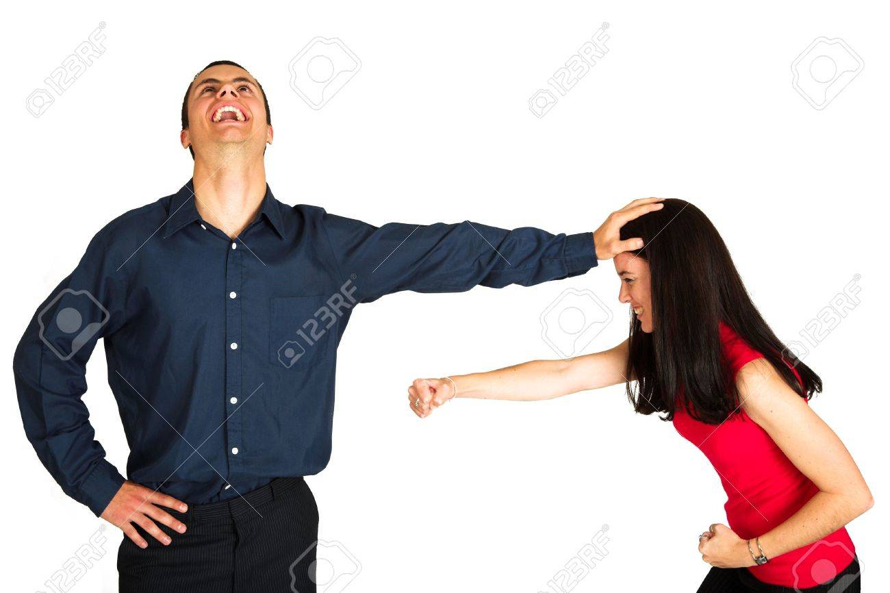 960749-Businessman-holding-a-female-coworker-away-who-is-trying-to-hit-him-while-laughing-manically-The-cou-Stock-Photo.jpg