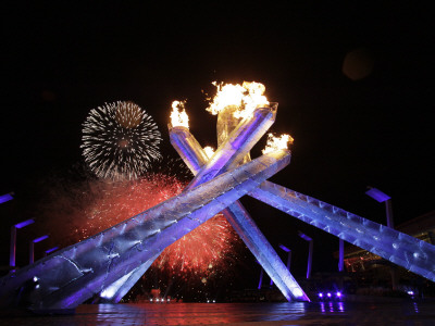fireworks-explode-behind-the-olympic-flame-at-opening-ceremony-of-vancouver-2010-winter-games.jpg