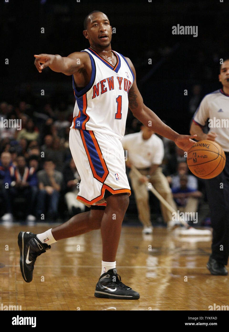 new-york-knicks-chris-duhon-directs-the-offense-in-the-first-quarter-of-a-preseason-game-against-the-philadelphia-76ers-at-madison-square-garden-in-new-york-city-on-october-13-2009-upijohn-angelillo-TYKFAD.jpg