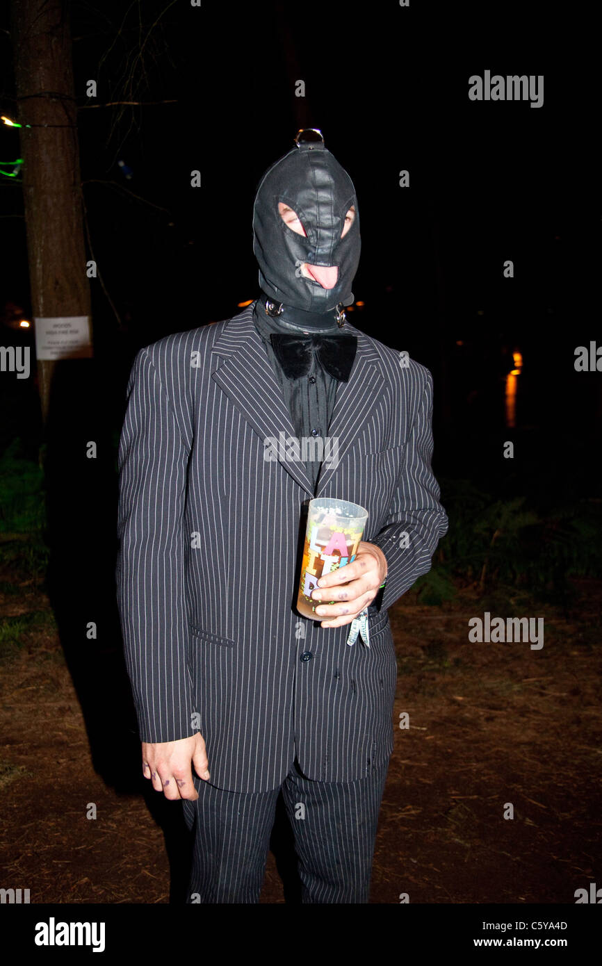 man-in-a-suit-wearing-a-gimp-mask-at-the-latitude-festival-2011-suffolk-C5YA4D.jpg