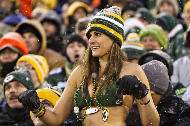 hi-res-458917171-fan-of-the-green-bay-packers-dances-in-the-snow-in-her_crop_exact.jpg