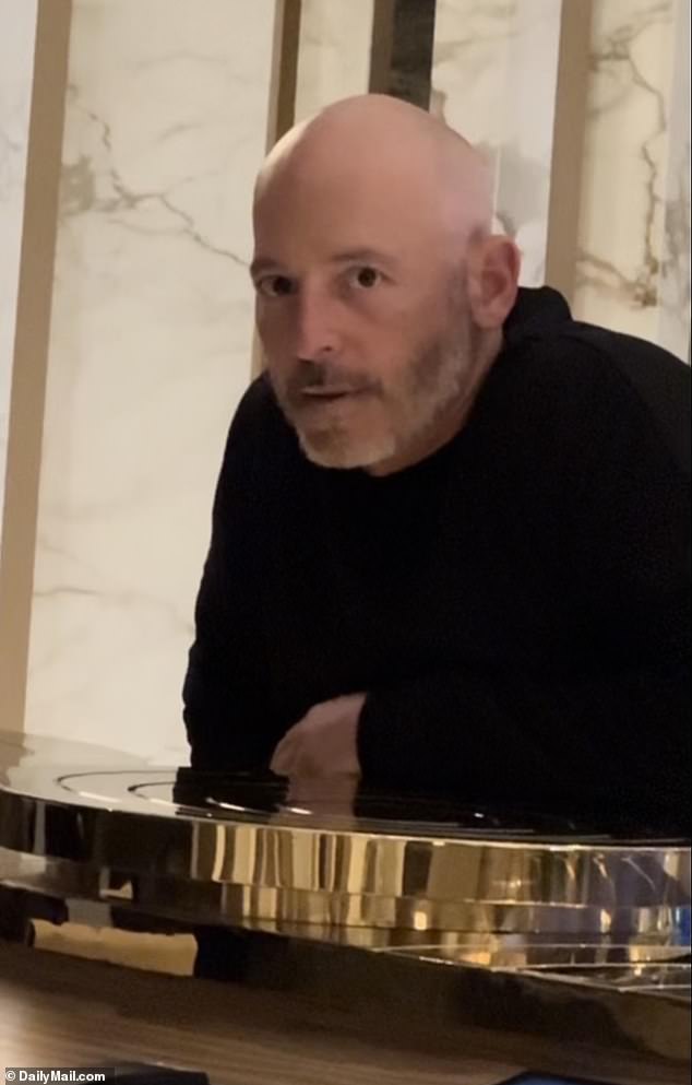 Seen: Photo and video obtained exclusively by DailyMail.com shows Pasternak in the lobby of a hotel where West is staying  - which a source called 'extremely suspect'