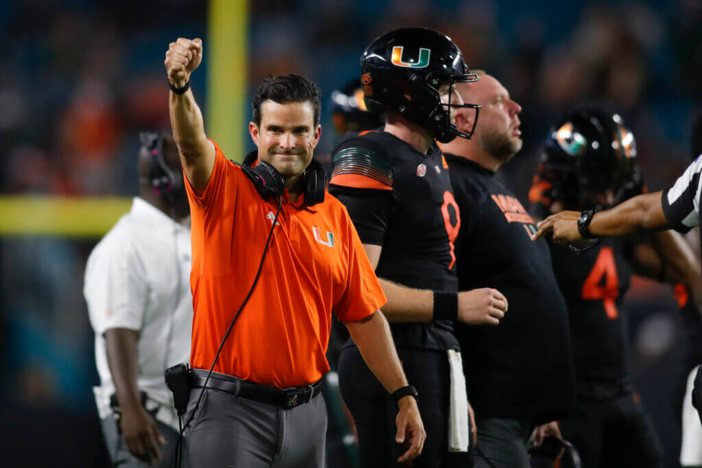 Oct 23, 2021; Miami Gardens, Florida, USA; Miami Hurricanes head coach Manny Diaz reacts after getting a first down against the North Carolina State Wolfpack during the third quarter of the game at Hard Rock Stadium. Mandatory Credit: Sam Navarro-USA TODAY Sports