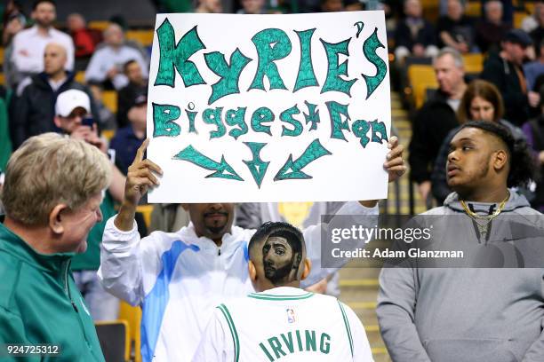 fan-of-kyrie-irving-of-the-boston-celtics-shows-off-his-haircut-a-picture-id924725312