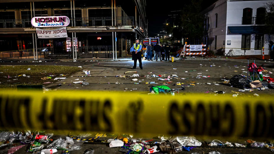 Police officers work at the scene of a shooting that occured during the Krewe of Bacchus parade in New Orleans, February 19, 2023. - New Orleans Deputy Police Chief Hans Ganthier said five people were shot, including a young girl, all of whom were taken to the hospital. (Photo by CHANDAN KHANNA / AFP) (Photo by CHANDAN KHANNA/AFP via Getty Images)