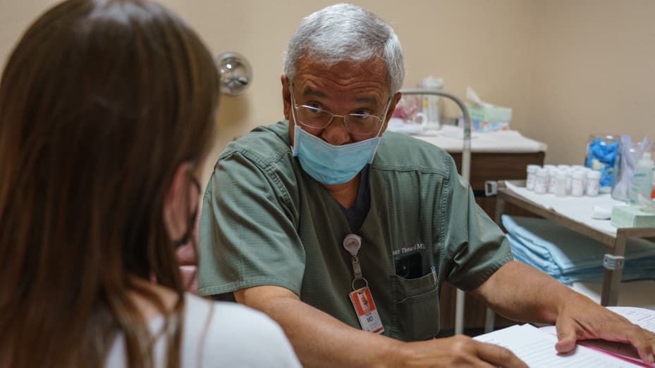 Dr. Franz Theard consults a woman seeking abortion from Oklahoma in his clinic, Womens Reproductive Clinic, a provider of abortions in Santa Teresa, New Mexico on May 7, 2022. Paul Ratje/The Washington Post via Getty Images