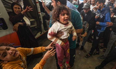 Palestinians, including children, wounded in Israeli attacks are brought to Nasser hospital for treatment in Khan Yunis, Gaza, on Tuesday.