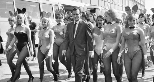 hefner-walking-with-women.jpg