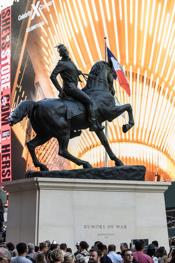 Artist Kehinde Wiley’s new 30-foot-tall sculpture ”Rumors of War” was unveiled in New York City’s Times Square. It will move to a permanent location in Virginia in December.