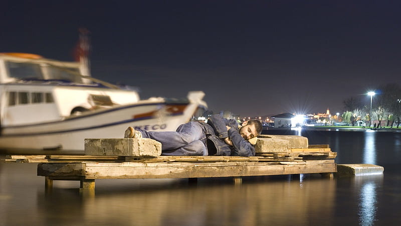 https://w0.peakpx.com/wallpaper/439/853/HD-wallpaper-man-sleeping-on-a-dock-boat-dock-sleep-man-lights-harbor-night.jpg