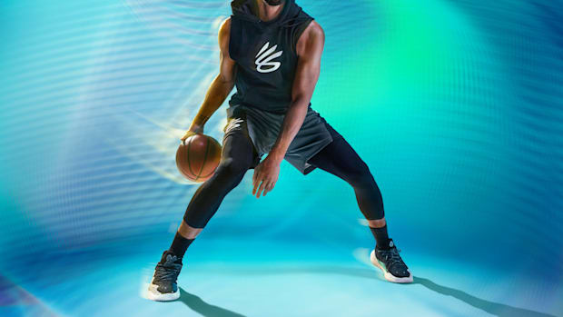 Stephen Curry dribbles a basketball in an Under Armour photo shoot.